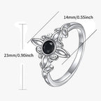 Silver-Tone Ring with Black Stone and Knot Design