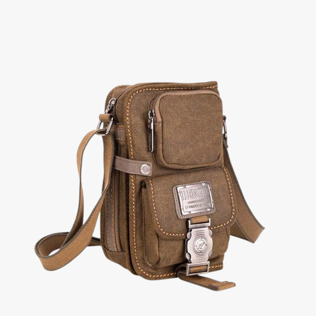 Crossbody-väska i vävt material med detaljer i konstläder
