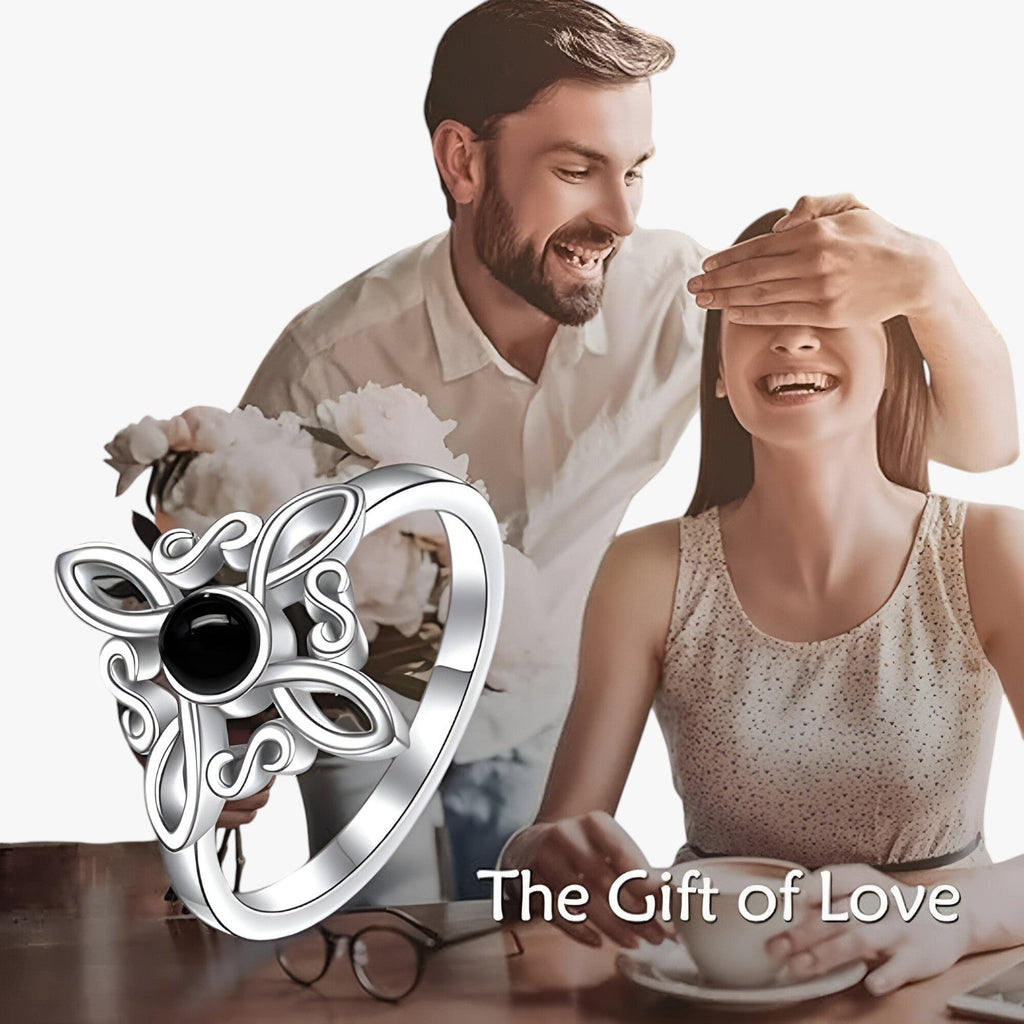 Silver-Tone Ring with Black Stone and Knot Design