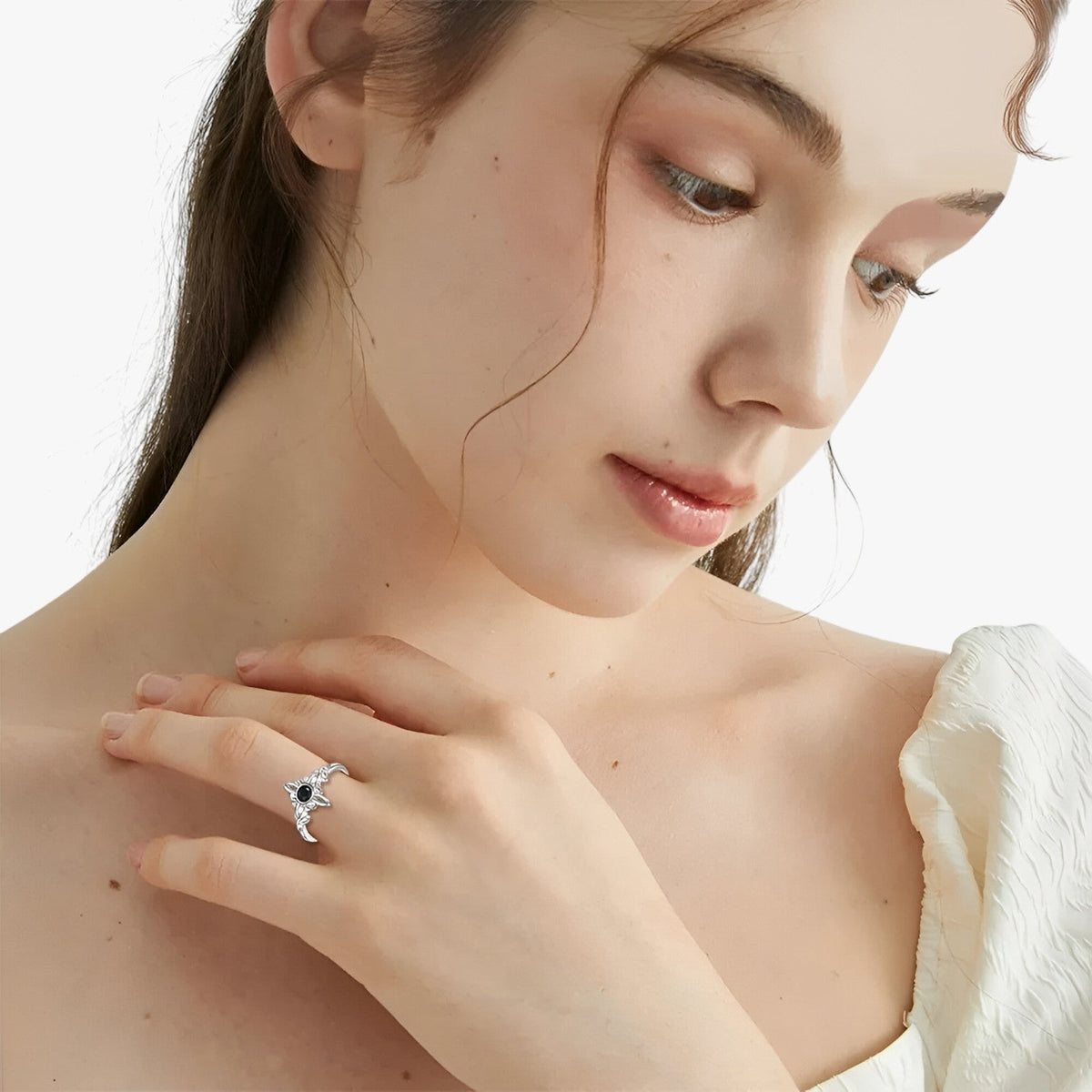 Silver-Tone Ring with Black Stone and Knot Design