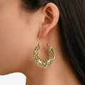 Pendientes grabados en tono plateado con acabado vintage