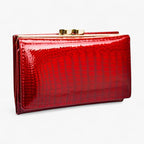 Cartera clutch de piel sintética con estampado de serpiente y correa de mano