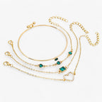 Gold-Tone Bracelet with Emerald and Zirconia Charm