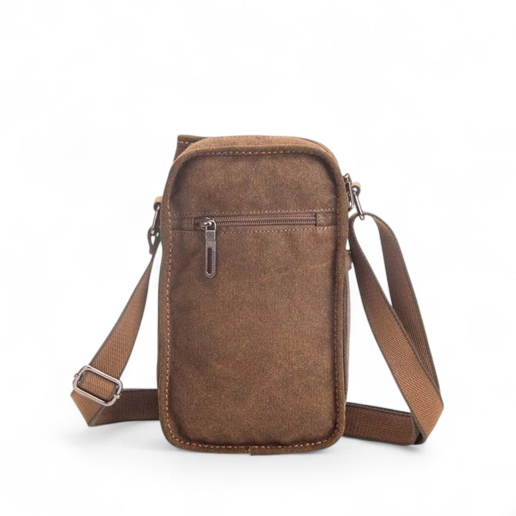 Crossbody-väska i vävt material med detaljer i konstläder