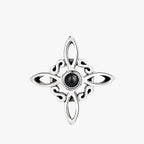 Silver-Tone Ring with Black Stone and Knot Design