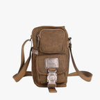 Crossbody-väska i vävt material med detaljer i konstläder