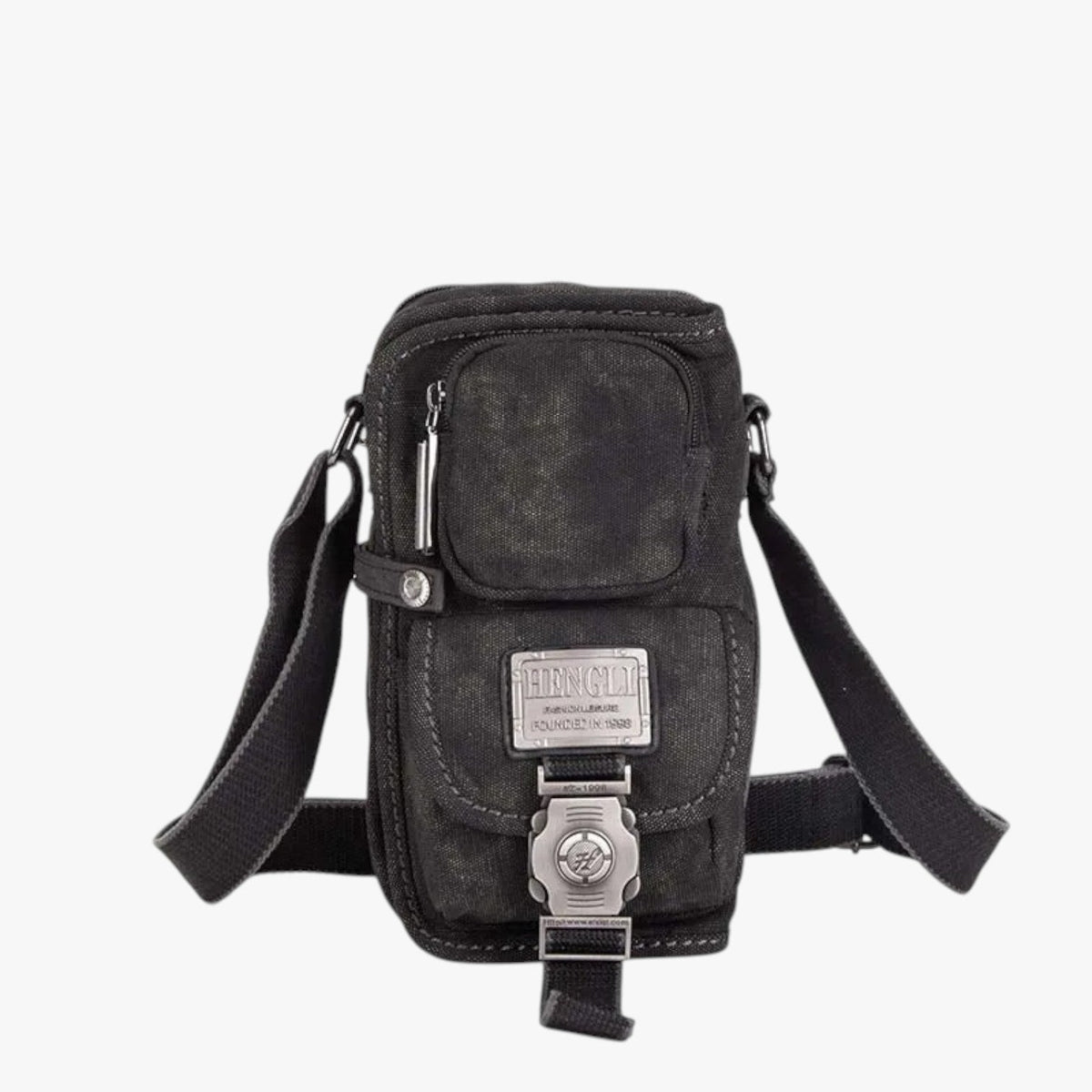 Crossbody-väska i vävt material med detaljer i konstläder