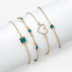Gold-Tone Bracelet with Emerald and Zirconia Charm