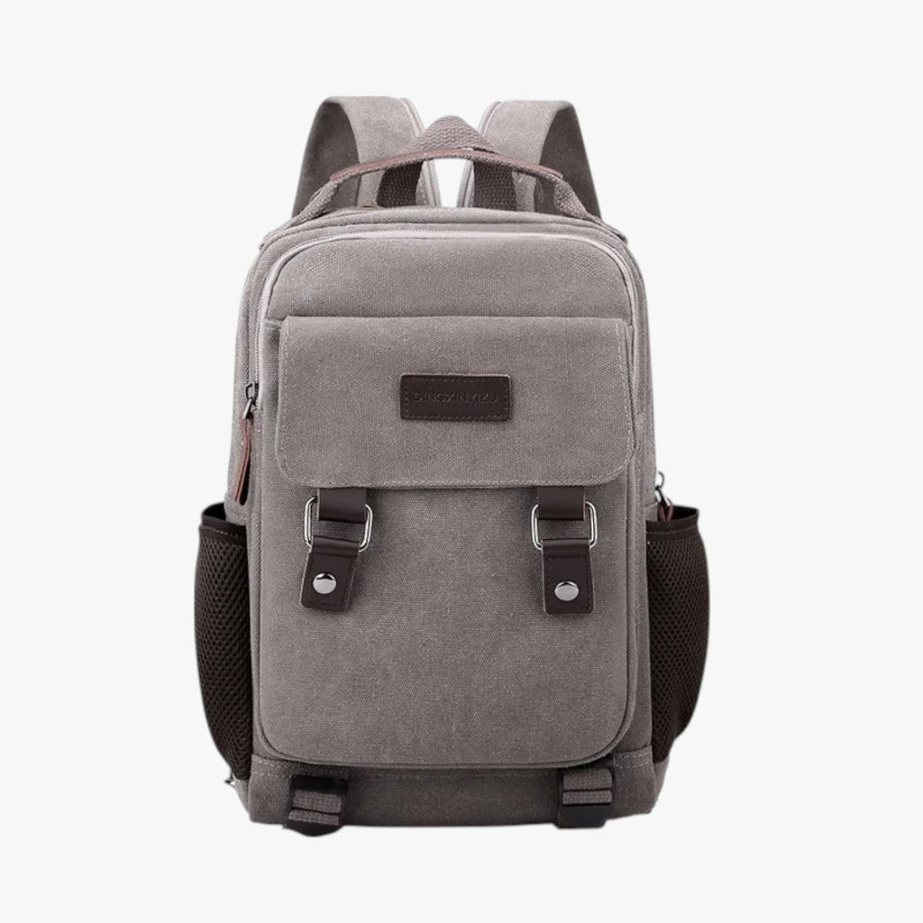 Mini mochila de lona con ribetes de piel sintética
