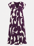 Vestido largo con cuello de pico, estampado artístico y mangas fluidas