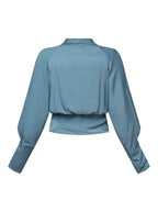 Draperad blus med V-ringning och subtil ärmvolym
