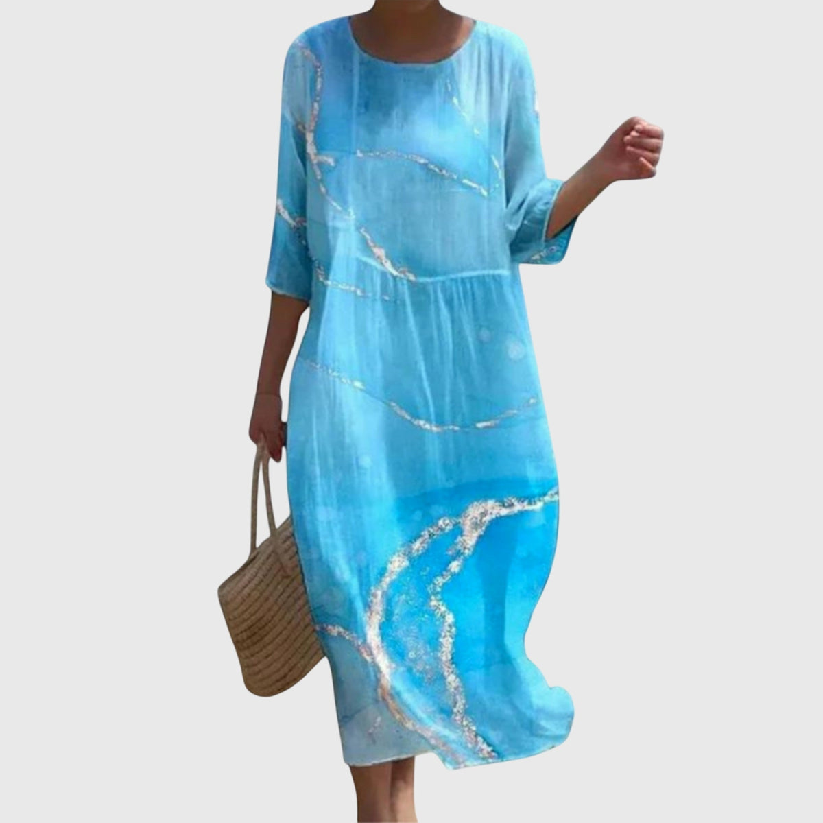 Blommig maxiklänning med flytande, feminin design