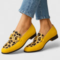Loafers i leopardmönster med bred öppning