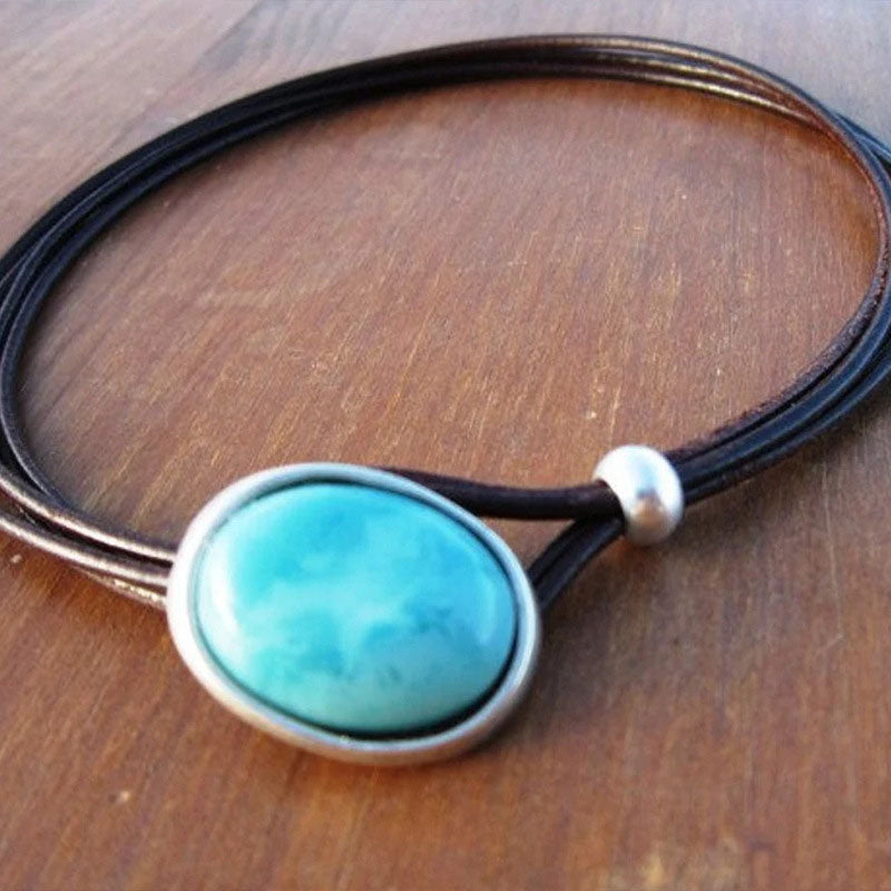 Vintagehalsband på lädersnöre med blågrön sten