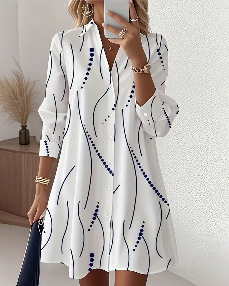 Vestido camisero con solapa ondulada y corte fluido