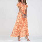 Vestido largo fluido con efecto cruzado, estampado sutil y cuello de pico
