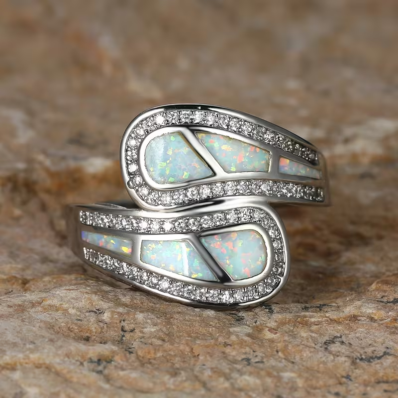 Iridescent White Stone Ring with Classic Setting and Gentle Shimmer