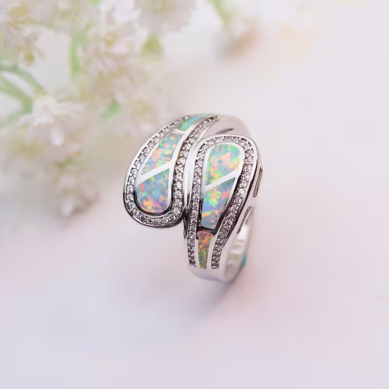 Iridescent White Stone Ring with Classic Setting and Gentle Shimmer