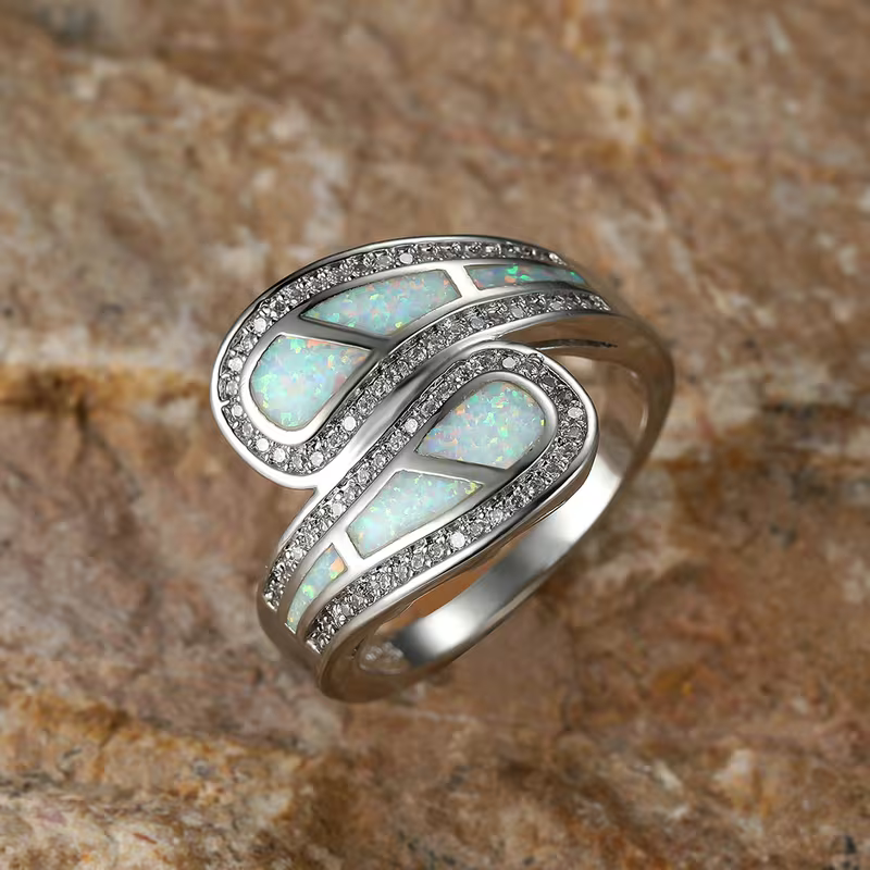 Iridescent White Stone Ring with Classic Setting and Gentle Shimmer