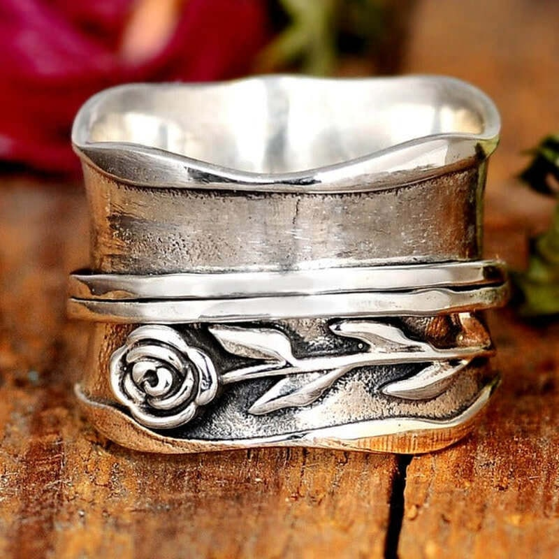 Wide Spinner Ring with Rose Relief in Silver Colour