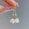 Iridescent White Stone Dangle Earrings in Gold Colour