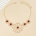 Red Stone Petal Necklace with Floral Arrangement and Rich Sparkle