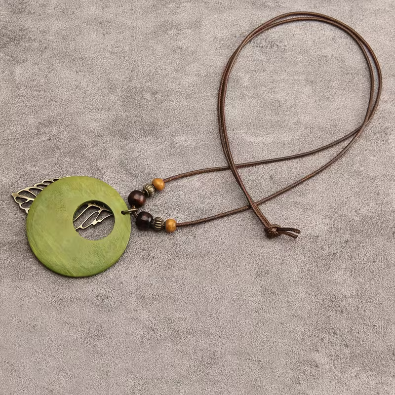 Green Disc and Filigree Leaf Pendant Necklace with Botanical Detail