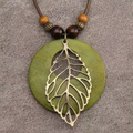 Green Disc and Filigree Leaf Pendant Necklace with Botanical Detail