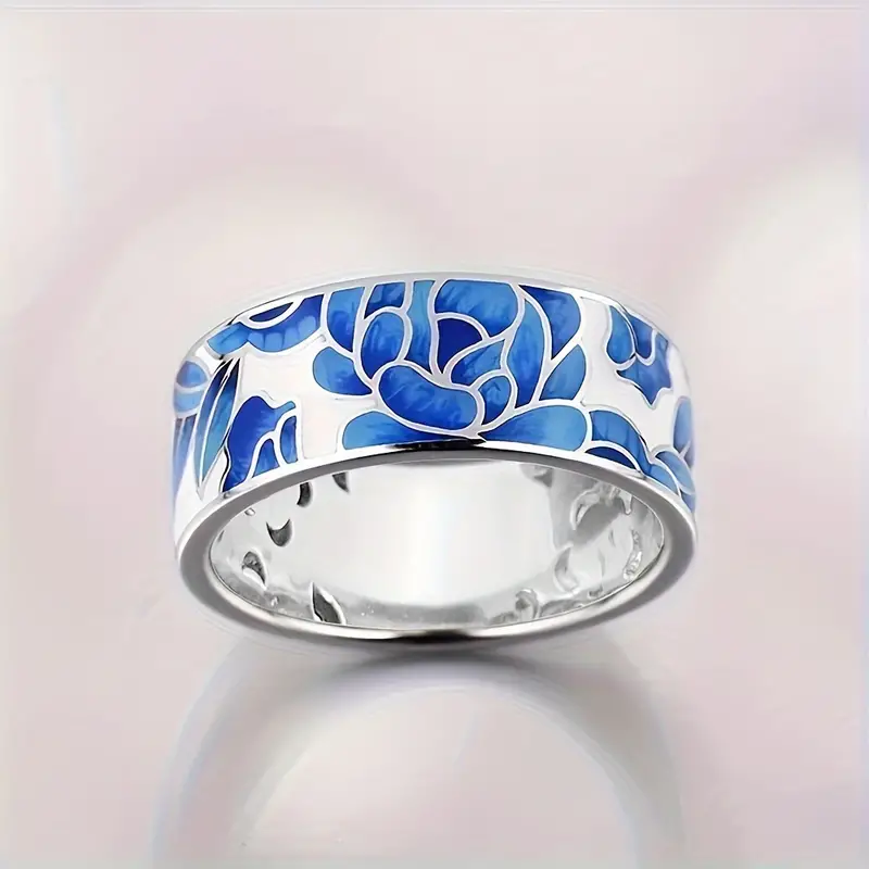 Ring i vintagestil med blå emaljblomma, silverfärgad