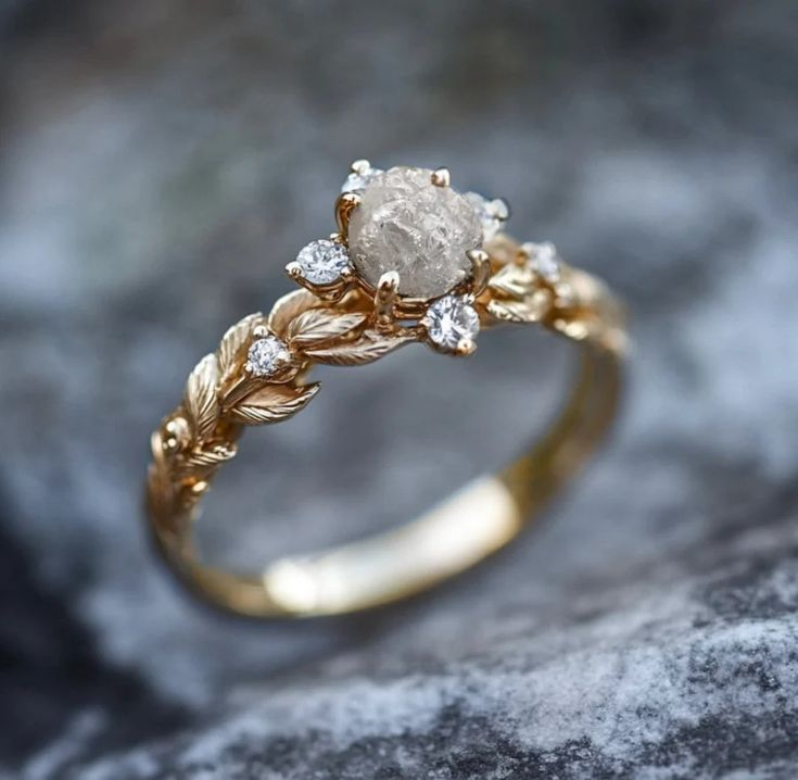 White Stone Ring with Ornate Decorative Setting in Gold Colour