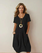 Vestido midi de algodón con escote redondo y bolsillos