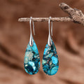 Pendientes artesanales de piedra regalita en forma de gota en azul océano