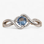 Silver-tone ring with blue cubic zirconia stone
