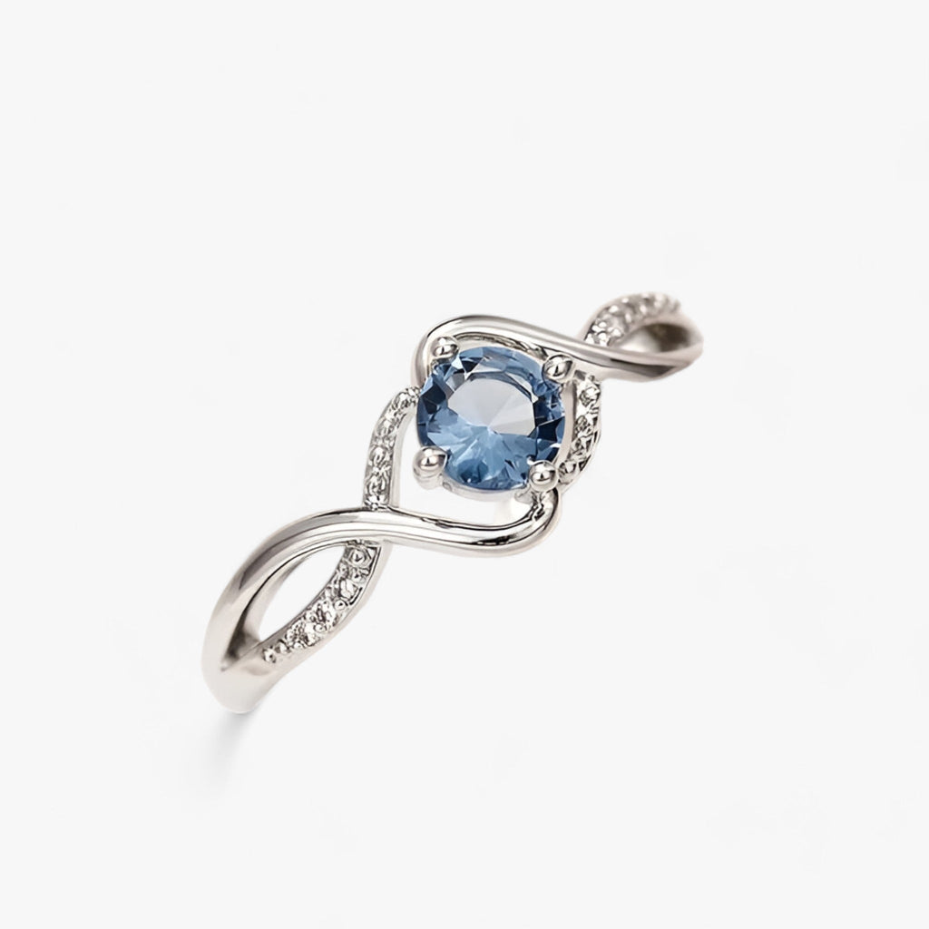 Silver-tone ring with blue cubic zirconia stone