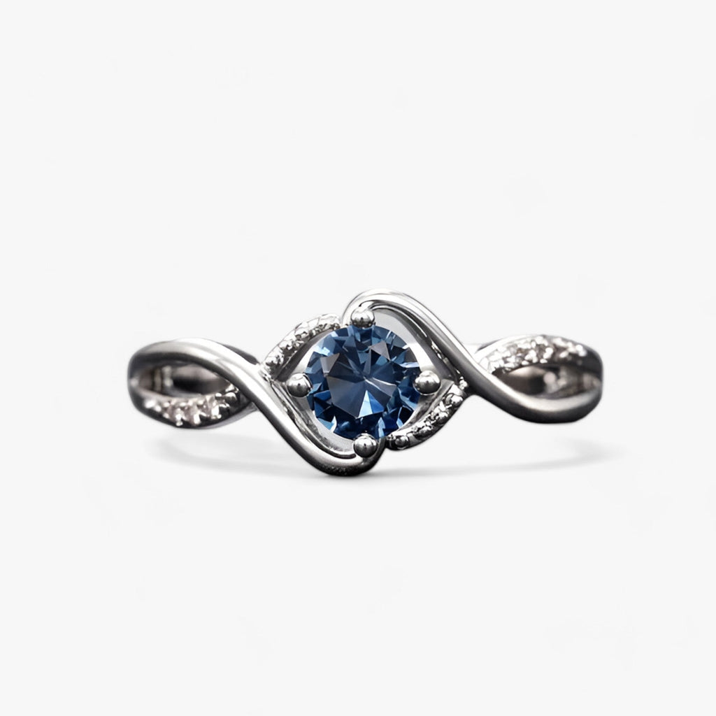 Silver-tone ring with blue cubic zirconia stone