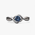 Silver-tone ring with blue cubic zirconia stone