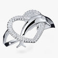 Anillo de corazón en tono plata con delfines entrelazados