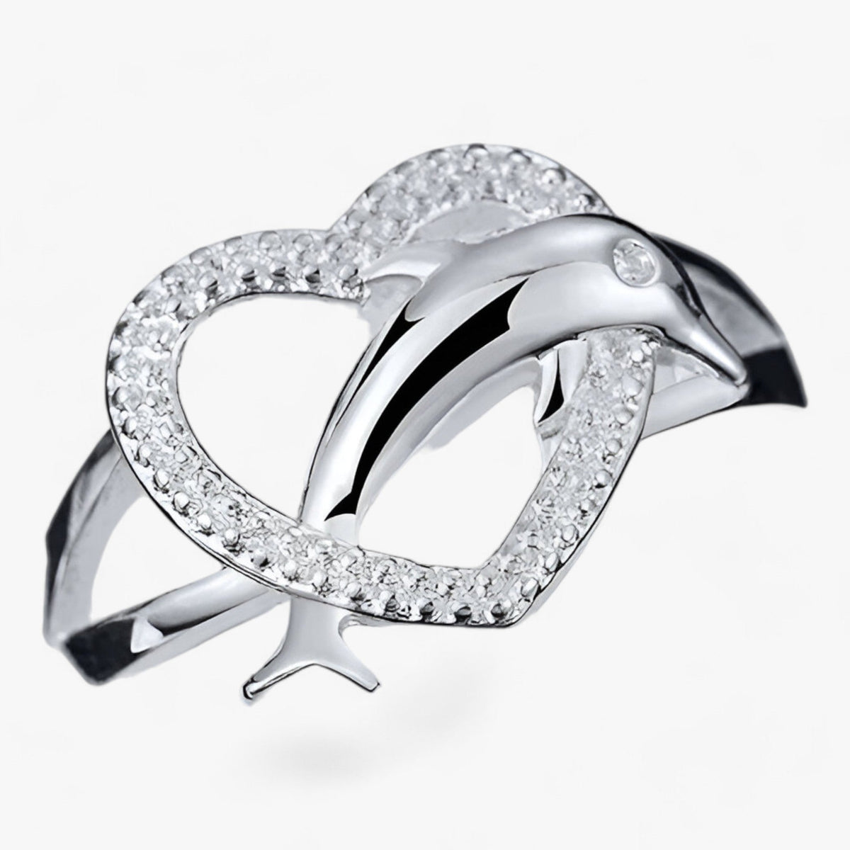 Anillo de corazón en tono plata con delfines entrelazados