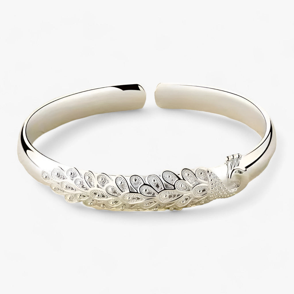 Statement-armband i metall med öppet påfågelmönster