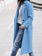 Avslappnad trenchcoat med brett slag och knäppning fram